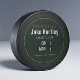Hockey puck with a personalized box score design