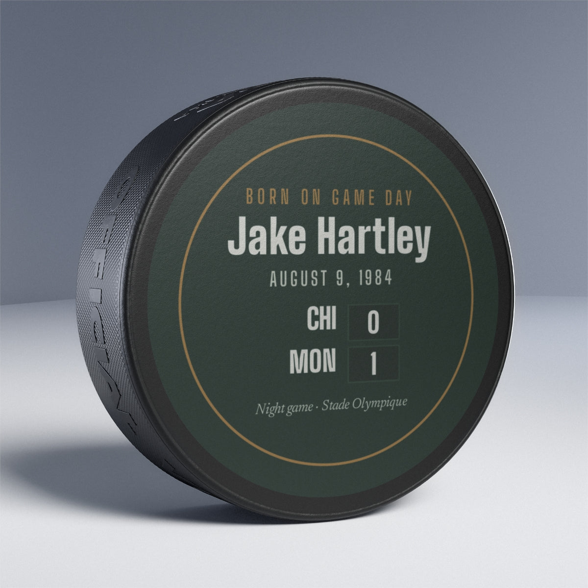 Hockey puck with a personalized box score design