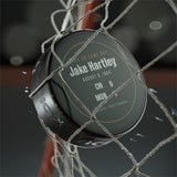 Hockey puck with a personalized box score design